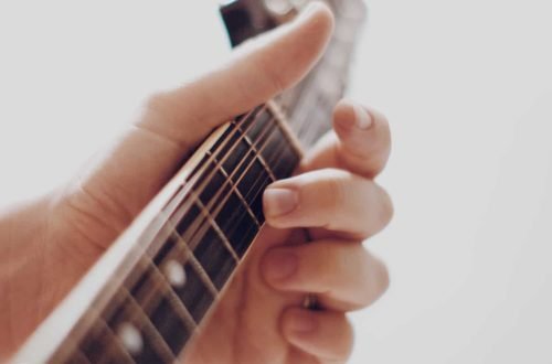 closeup-bokeh-of-hand-on-mandolin-strings.jpg