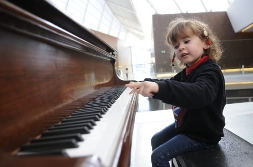 little-girl-having-fun-playing-the-piano.jpg